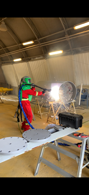 Thermal spray metalizing on steel in the shop