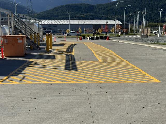 Hatched safety markings near site equipment