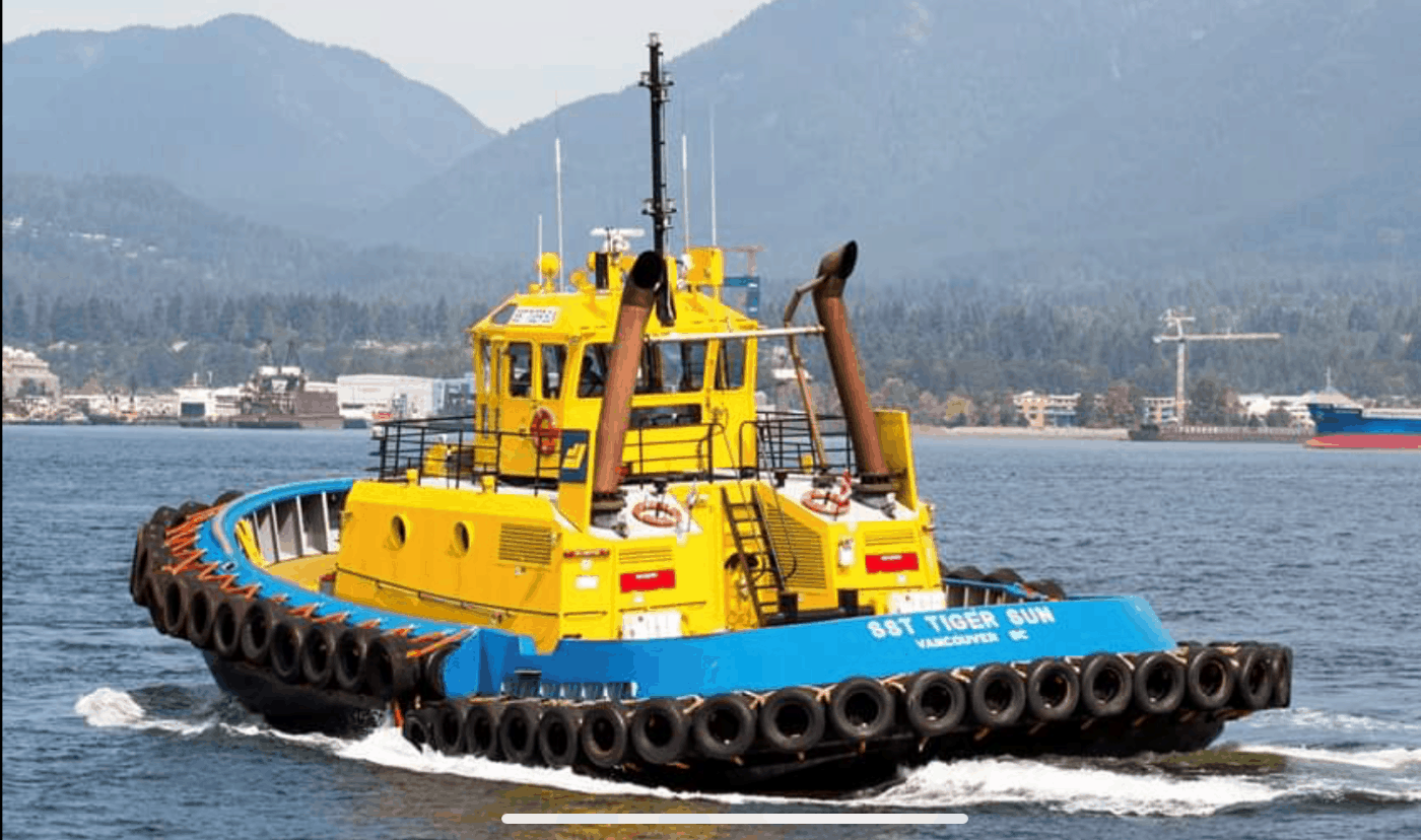 Tug with coated hull underway